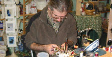 Niklaus Morin demonstrating how to tie fishing flies.